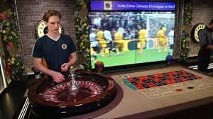 Live Domino QQ table with four players and visible domino tiles