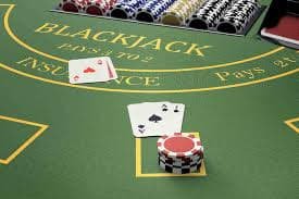 Live dealer blackjack table with betting interface and camera feed